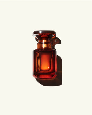 30ml Bottle of Fenty Eau de Parfumon a cream colored background.
