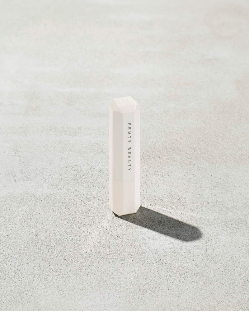 Packaging of Pro Kiss'r Lip-Loving Scrubstick, featuring a very light pink color with the prominent "Fenty Beauty by Rihanna" branding.
