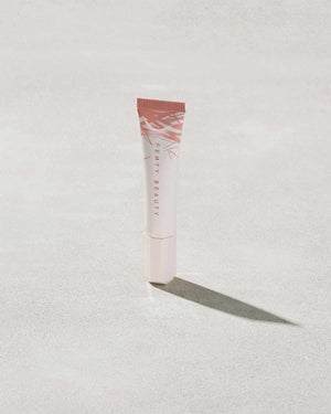 Closed Tube of Pro Kiss'r Luscious Lip Balm in shade Latte Lips on grey background.